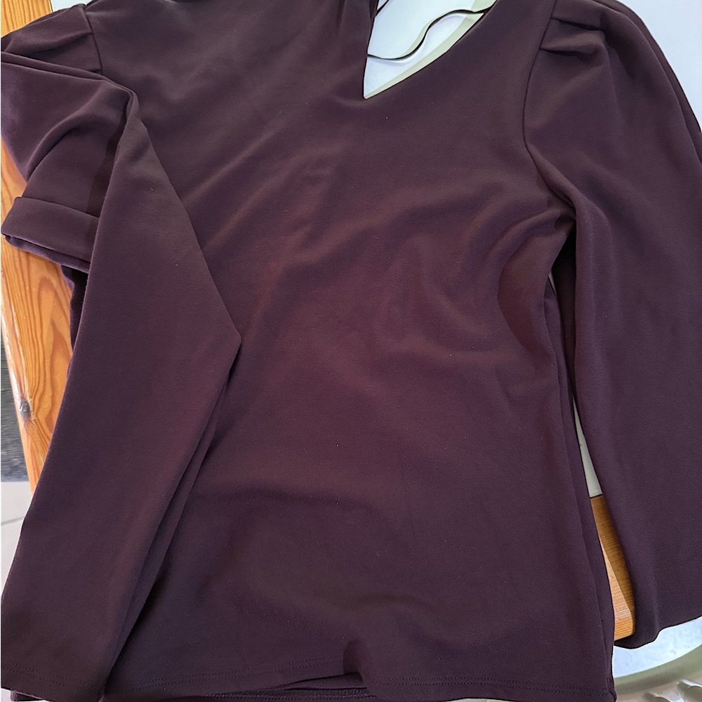 One off shoulder peek a boo look knit plum top used once
